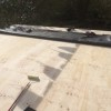 Large Shed Roof Being Sealed
